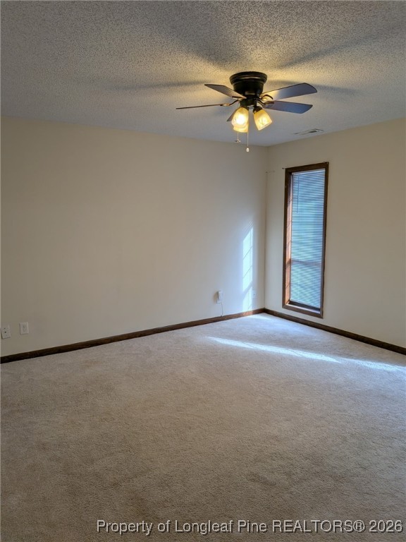 481 Sierra Trail Spring Lake, NC 28390 - Photo 8 of 24 a view of an empty room with a ceiling fan