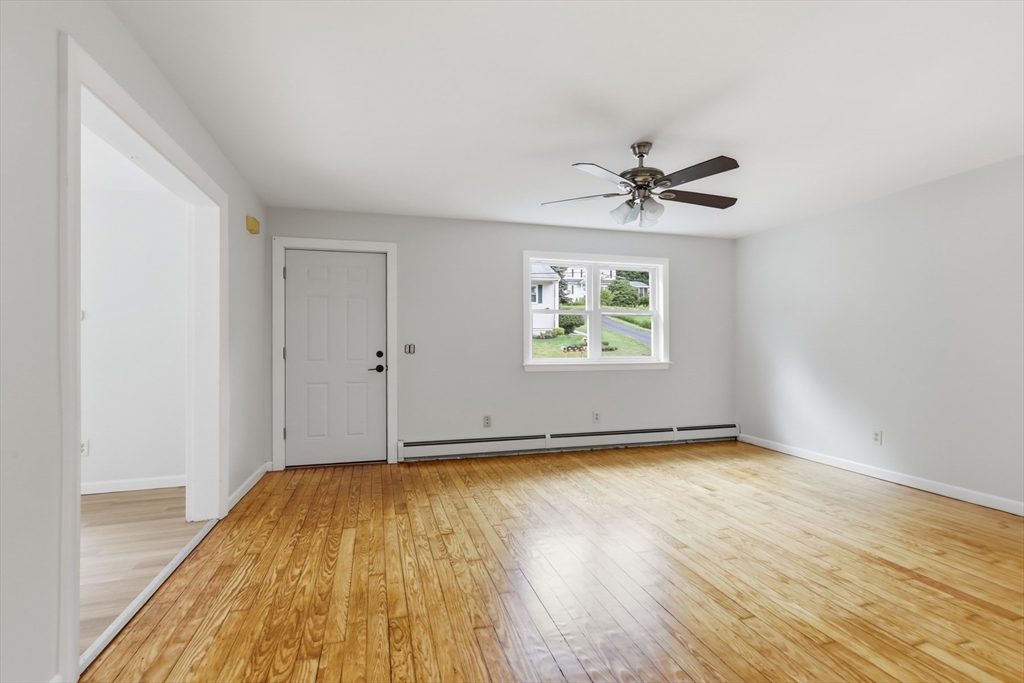 1007 Boston Road Haverhill, MA 01835 - Photo 15 of 32 wooden floor in a empty room with a window