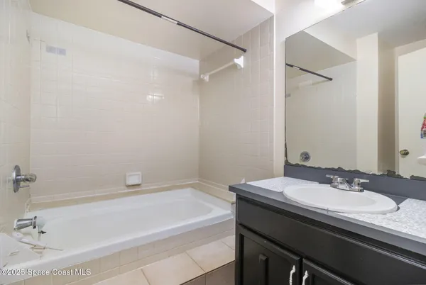 a bathroom with a bathtub and a sink