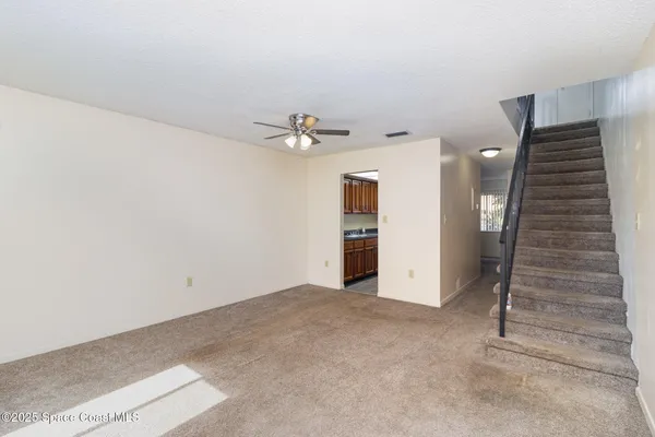 a view of an empty room with a bathroom