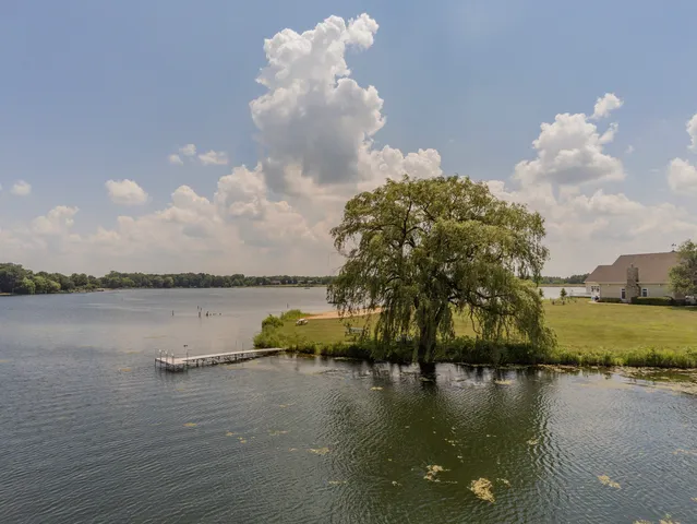 an aerial view of a golf course with parking space