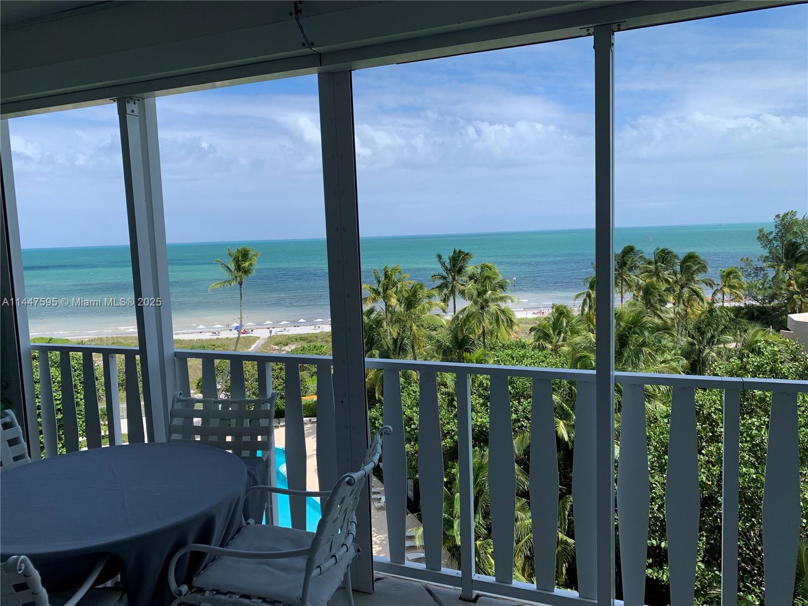200 Ocean Ln Drive, Unit 706 Key Biscayne, FL 33149 - Photo 1 of 28 a view of a balcony with chairs