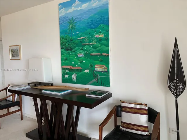 a view of a dining room with furniture and window