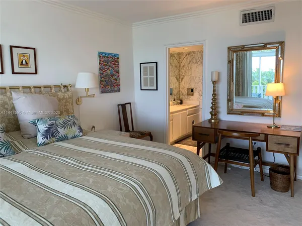 a bedroom with a bed and a table