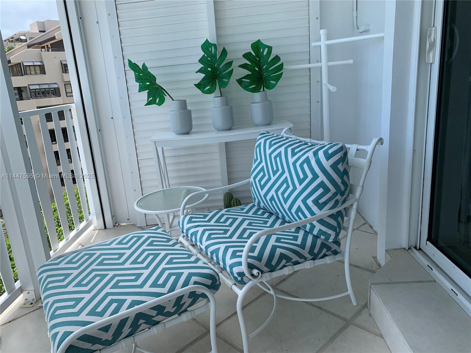 200 Ocean Ln Drive, Unit 706 Key Biscayne, FL 33149 - Photo 17 of 28 a view of a balcony with furniture