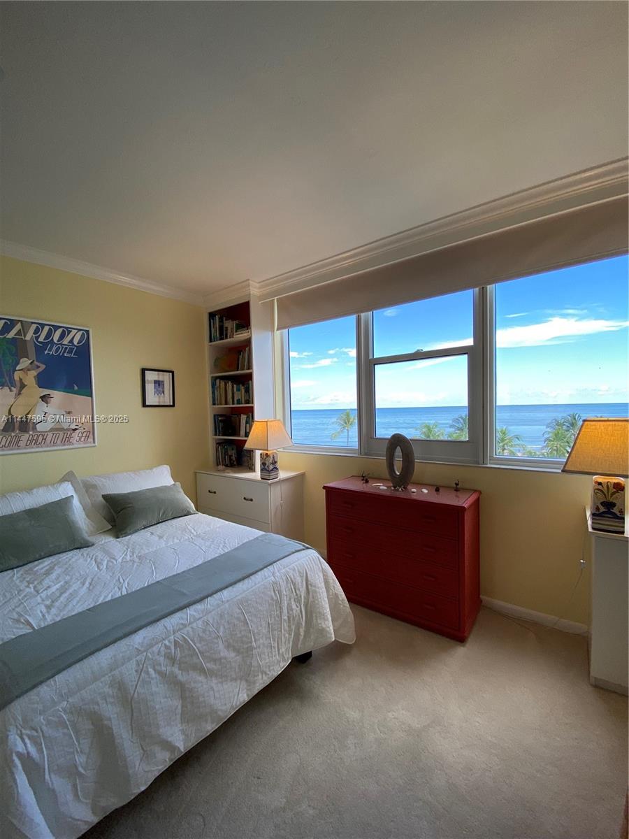 200 Ocean Ln Drive, Unit 706 Key Biscayne, FL 33149 - Photo 2 of 28 a bedroom with a large bed and a large window