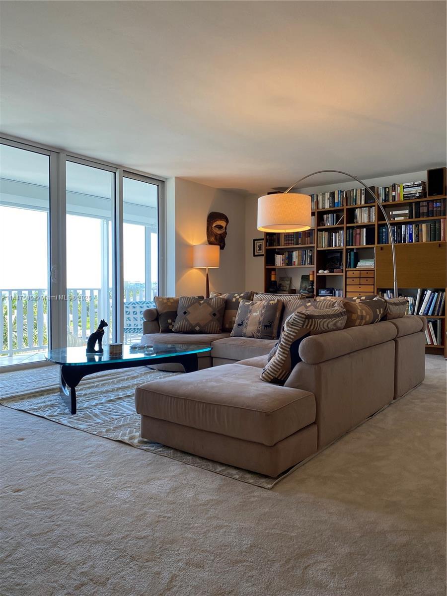 200 Ocean Ln Drive, Unit 706 Key Biscayne, FL 33149 - Photo 24 of 28 a living room with furniture and a large window