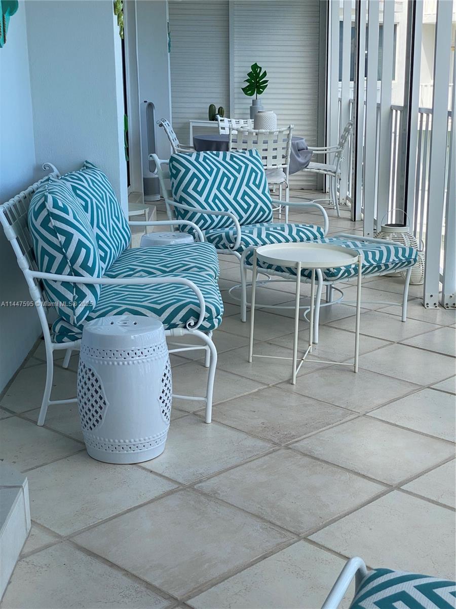 200 Ocean Ln Drive, Unit 706 Key Biscayne, FL 33149 - Photo 25 of 28 a view of a dining room with furniture