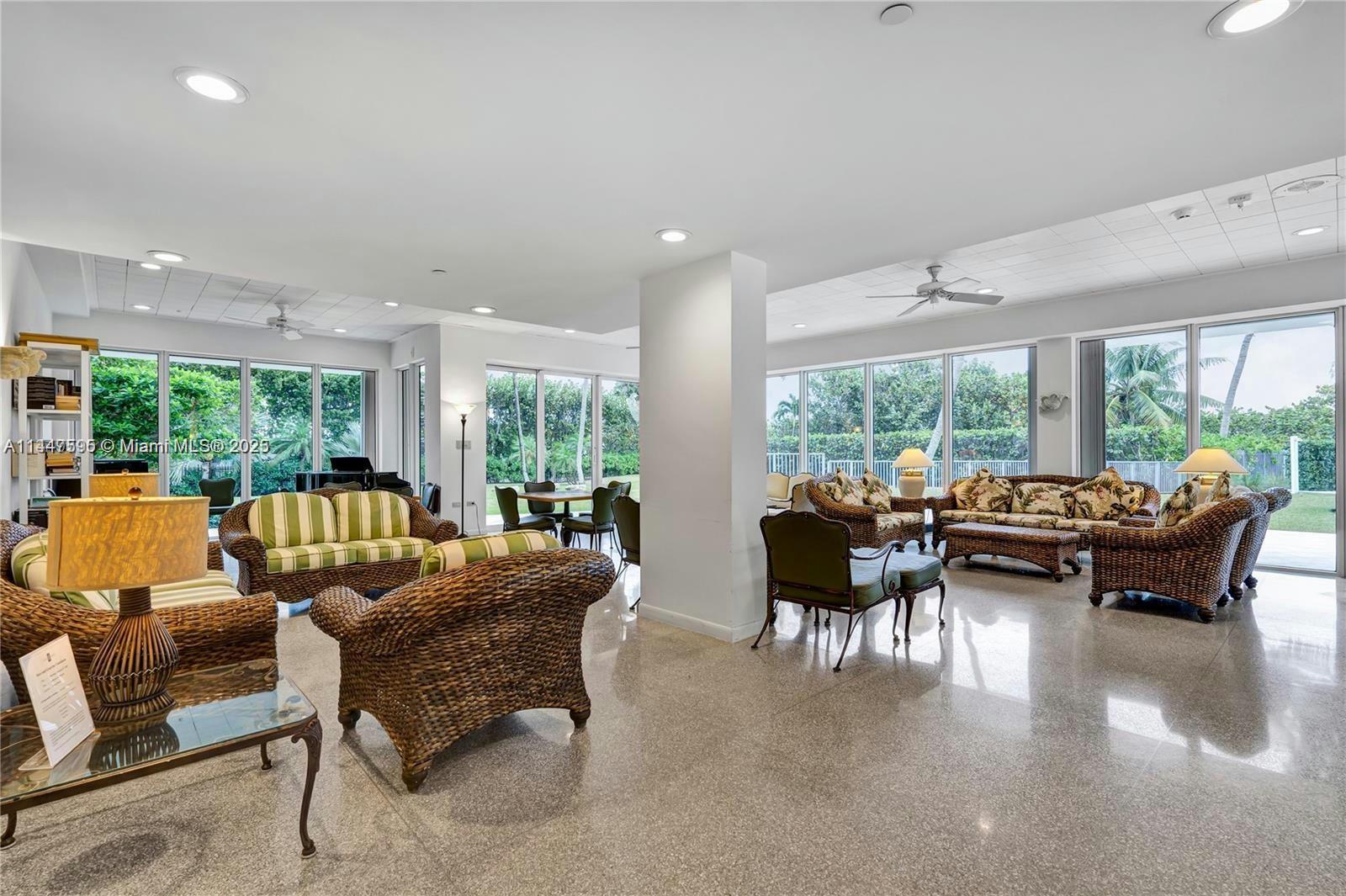 200 Ocean Ln Drive, Unit 706 Key Biscayne, FL 33149 - Photo 7 of 28 a living room with furniture and a large window