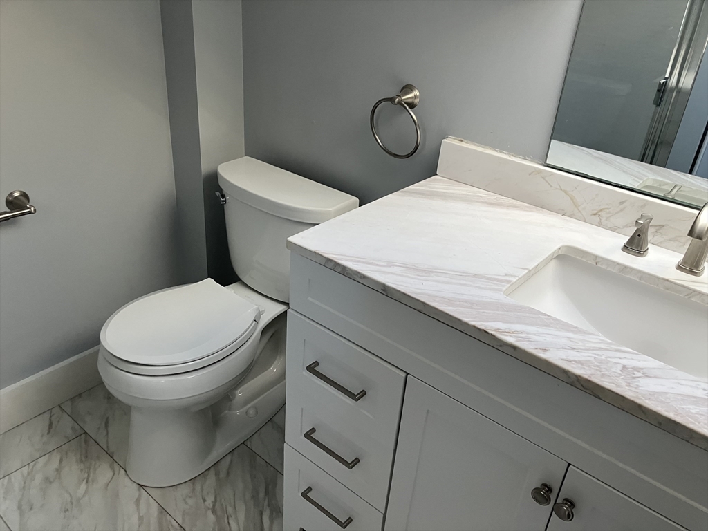 975 South Main Street, Unit 2 Attleboro, MA 02703 - Photo 14 of 17 a bathroom with a sink and a toilet