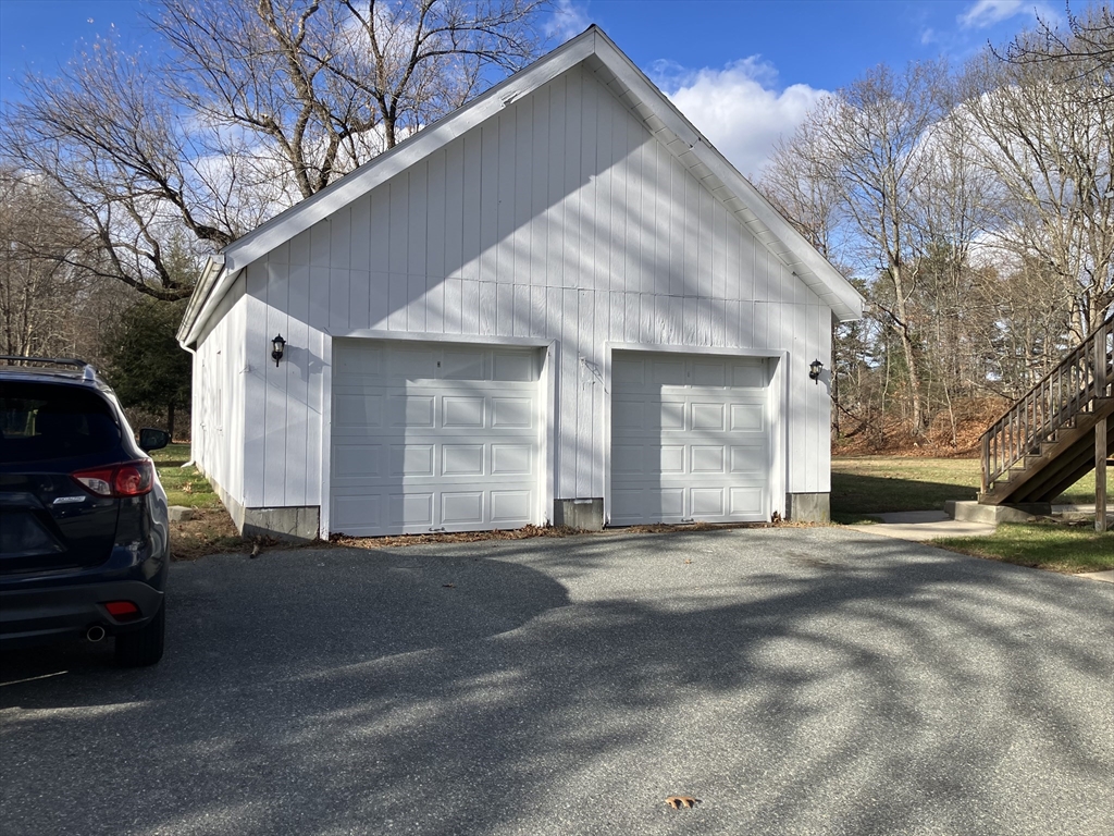 975 South Main Street, Unit 2 Attleboro, MA 02703 - Photo 3 of 17 a view of a car in front of a house