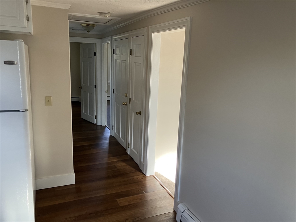 975 South Main Street, Unit 2 Attleboro, MA 02703 - Photo 6 of 17 a view of a hallway with wooden floor