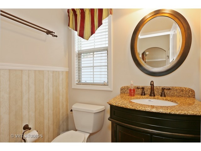 616 Parkway Drive Wheaton, IL 60187 - Photo 19 of 24 a bathroom with a sink and a mirror