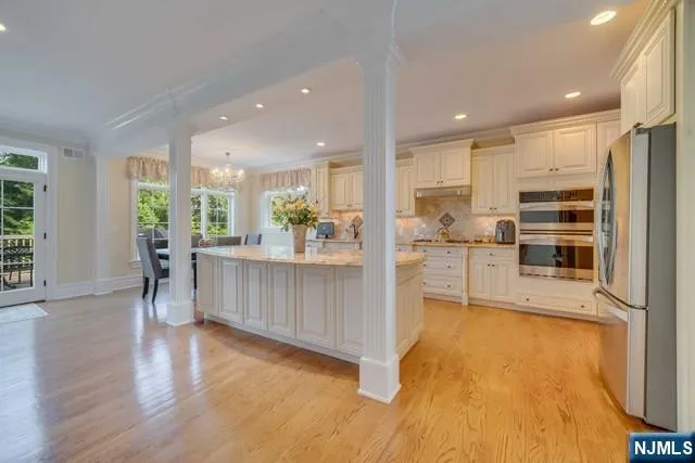 a spacious bathroom with a glass shower door and a bathtub