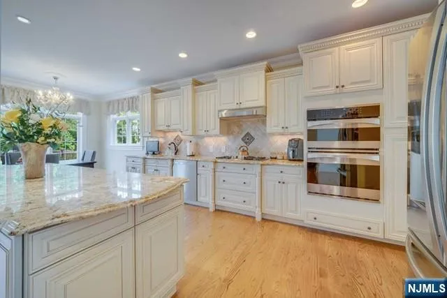 a view of a patio with table and chairs and potted plants