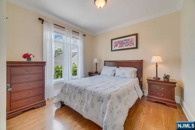 an aerial view of a house with swimming pool garden and patio