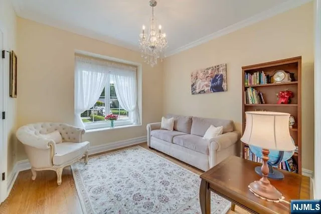 a view of a roof deck with table and chairs with wooden floor and fence