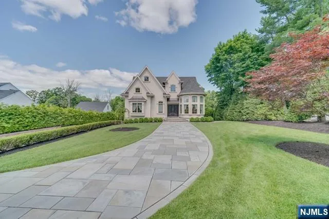 a living room with fireplace furniture and a wooden floor