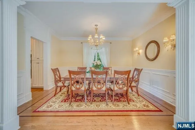 a large kitchen with granite countertop a large counter top a sink stainless steel appliances and cabinets