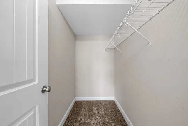 a bathroom with a sink toilet and a mirror