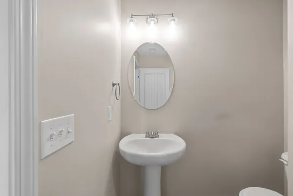a kitchen with a sink and chandelier