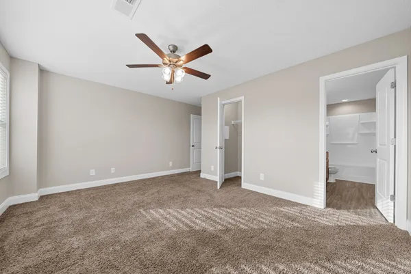 a bathroom with a double vanity sink a toilet and a mirror