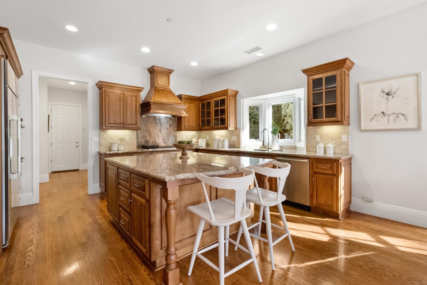 21190 Canyon Oak Way Cupertino, CA 95014 - Photo 11 of 72 a kitchen with kitchen island stainless steel appliances a sink and cabinets