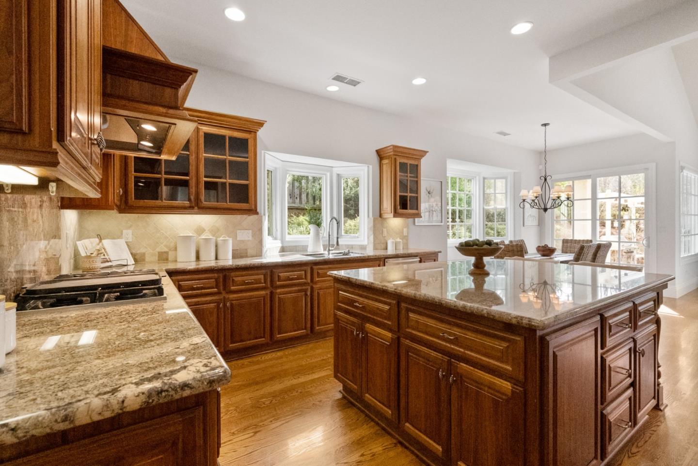 21190 Canyon Oak Way Cupertino, CA 95014 - Photo 13 of 72 a kitchen with stainless steel appliances granite countertop a stove and a sink