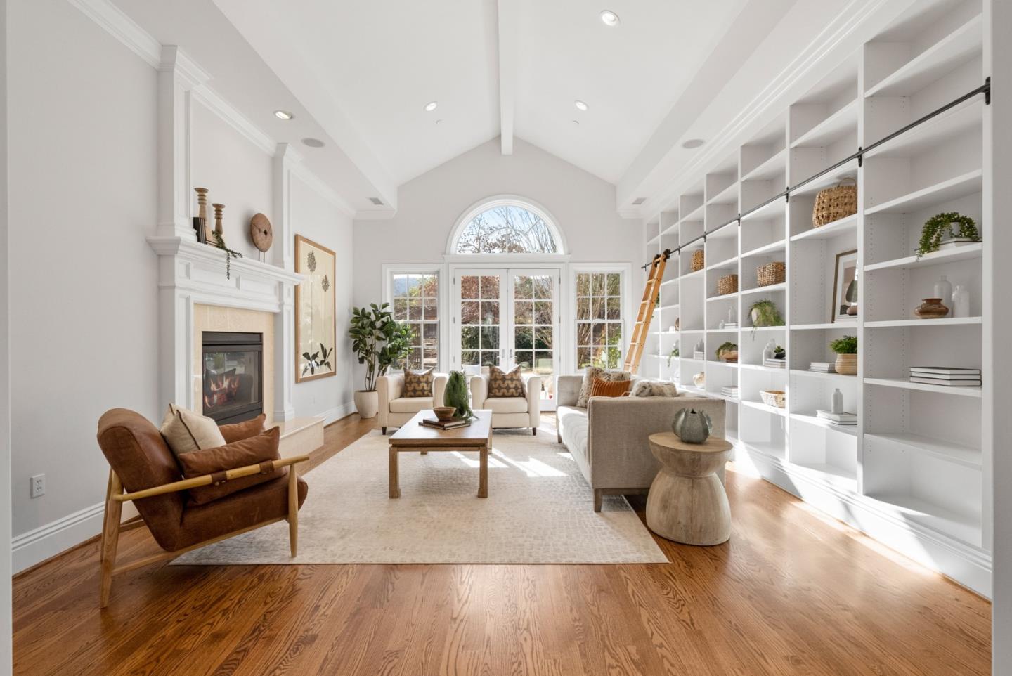 21190 Canyon Oak Way Cupertino, CA 95014 - Photo 17 of 72 a living room with furniture a fireplace and a large window
