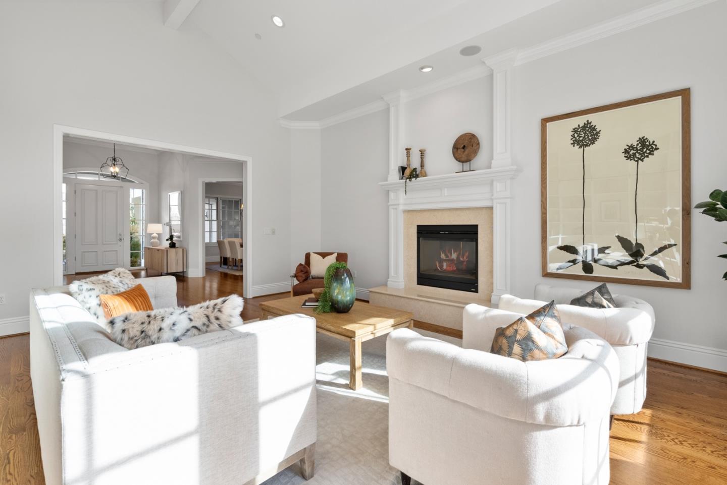21190 Canyon Oak Way Cupertino, CA 95014 - Photo 19 of 72 a living room with furniture a fireplace and a large window