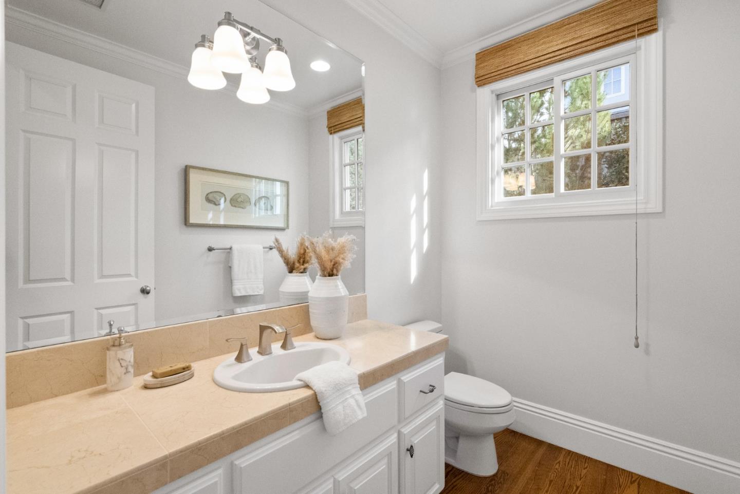 21190 Canyon Oak Way Cupertino, CA 95014 - Photo 36 of 72 a bathroom with a sink a toilet and a mirror