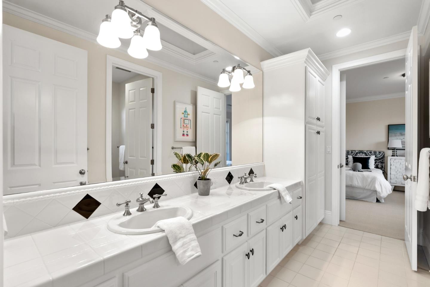 21190 Canyon Oak Way Cupertino, CA 95014 - Photo 39 of 72 a bathroom with a sink double vanity and a mirror