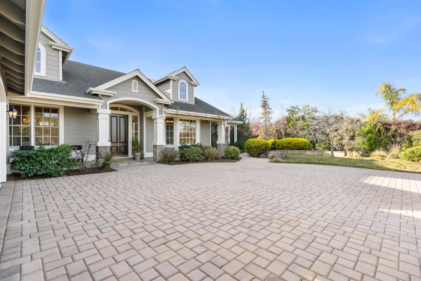 21190 Canyon Oak Way Cupertino, CA 95014 - Photo 5 of 72 a front view of a house with a yard and a garden