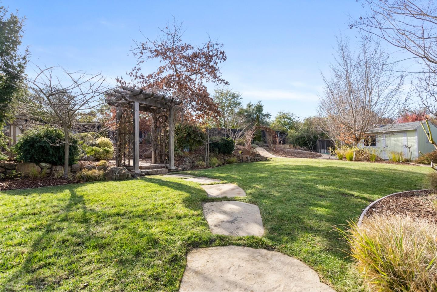 21190 Canyon Oak Way Cupertino, CA 95014 - Photo 52 of 72 a view of backyard of house with outdoor seating and green space