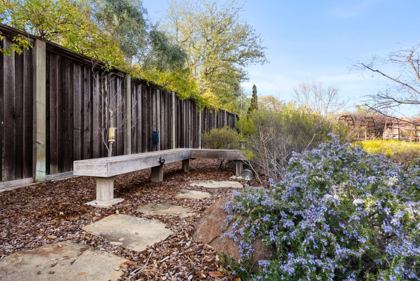 21190 Canyon Oak Way Cupertino, CA 95014 - Photo 58 of 72 a view of a backyard with a patio and wooden fence