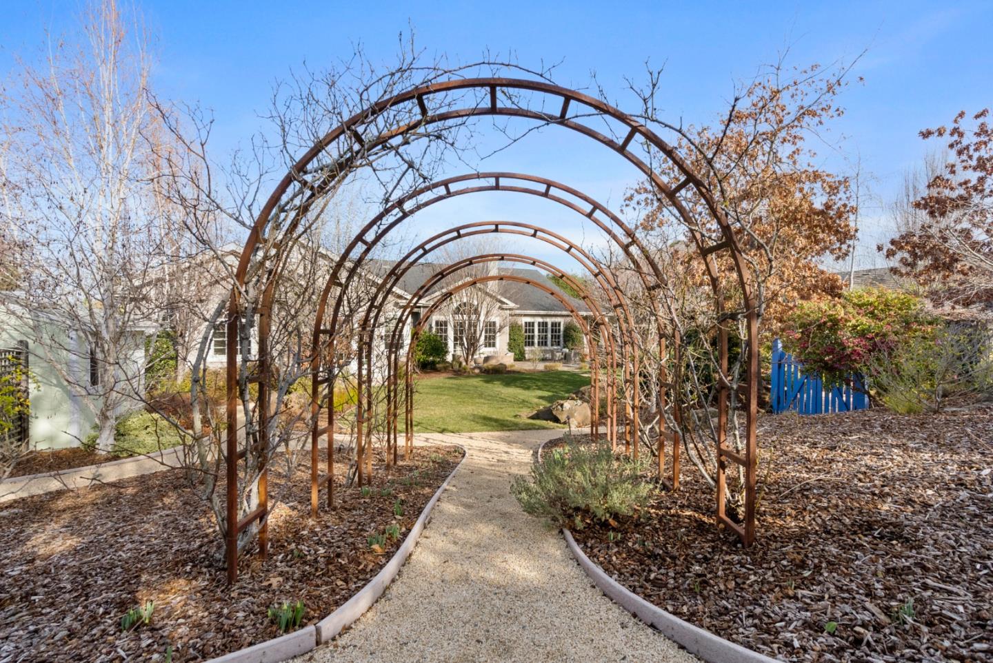 21190 Canyon Oak Way Cupertino, CA 95014 - Photo 61 of 72 a view of a grey house with a small yard