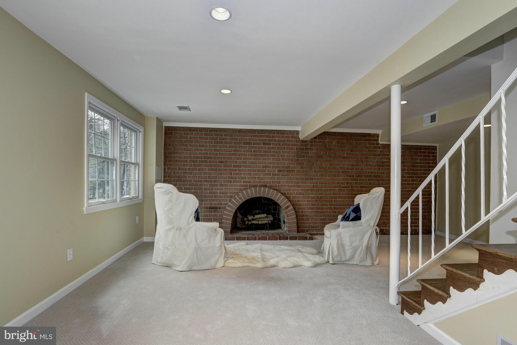 14117 Sturtevant Road Silver Spring, MD 20905 - Photo 19 of 30 a view of a livingroom with furniture and a fireplace