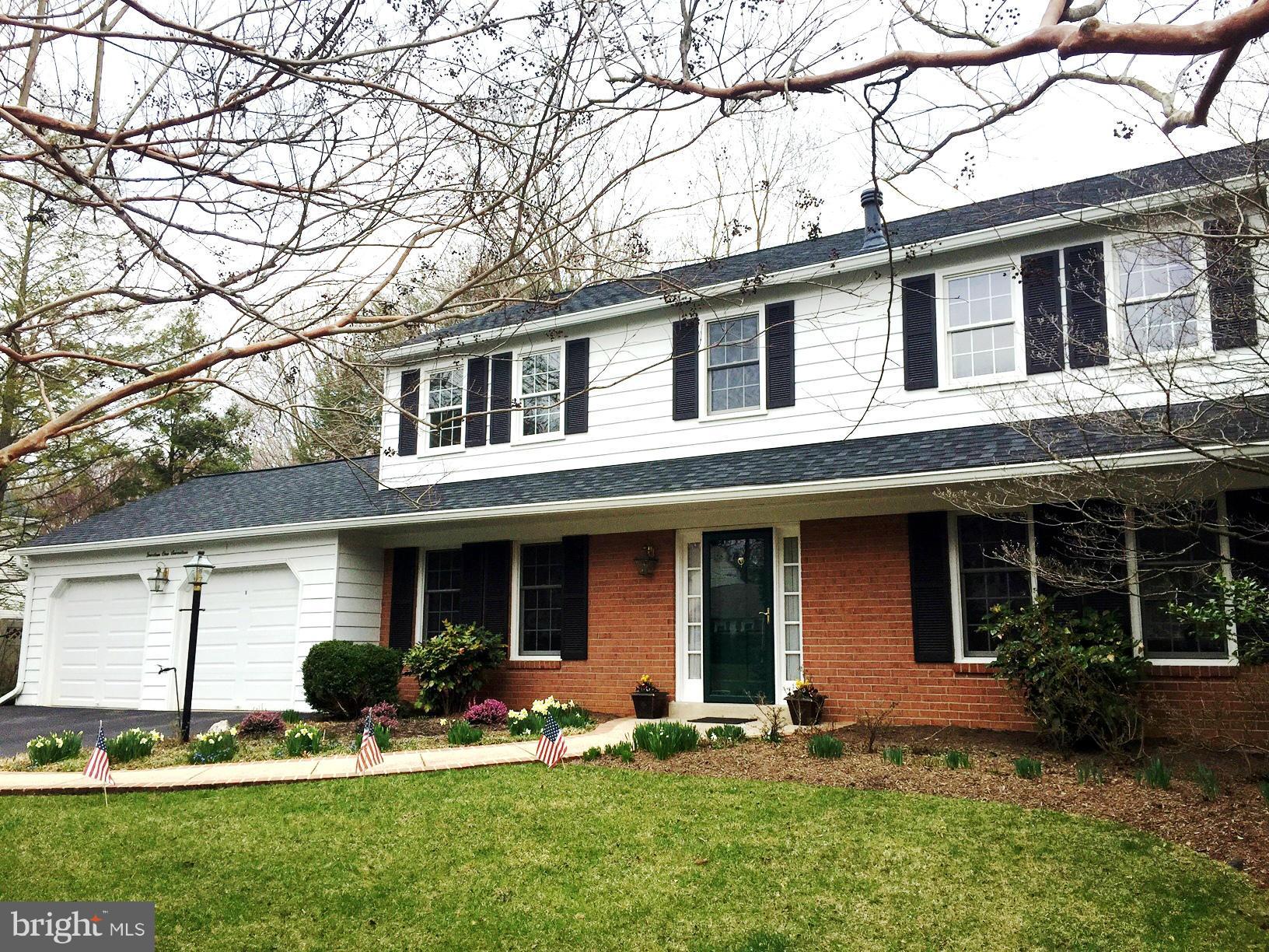 14117 Sturtevant Road Silver Spring, MD 20905 - Photo 3 of 30 a front view of a house with a yard and porch