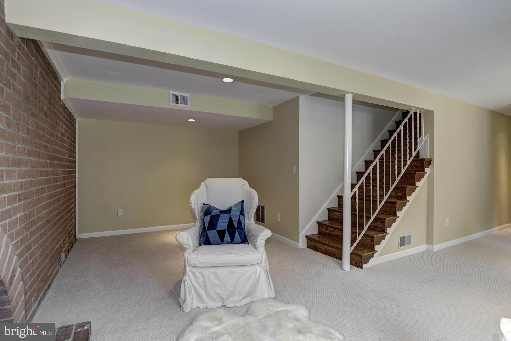 14117 Sturtevant Road Silver Spring, MD 20905 - Photo 21 of 30 a view of a livingroom with stairs and furniture