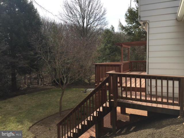 14117 Sturtevant Road Silver Spring, MD 20905 - Photo 25 of 30 a view of balcony with wooden floor and fence