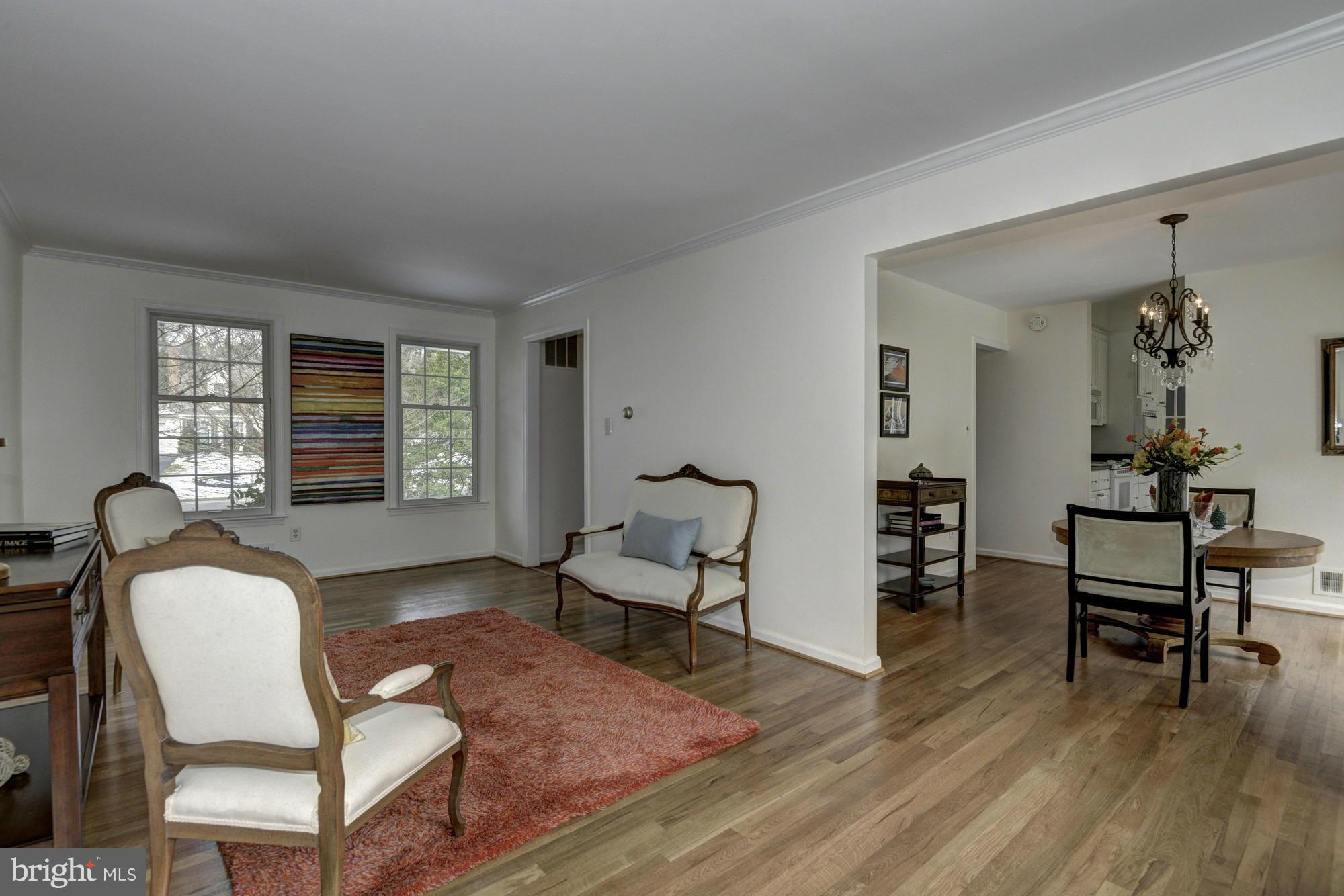 14117 Sturtevant Road Silver Spring, MD 20905 - Photo 10 of 30 a living room with furniture and a wooden floor