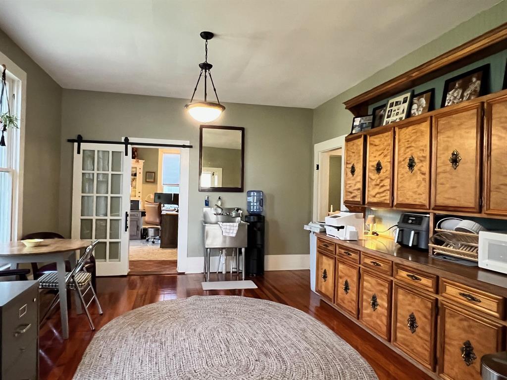 306 North Austin Street Comanche, TX 76442 - Photo 11 of 37 a bedroom with furniture and a window