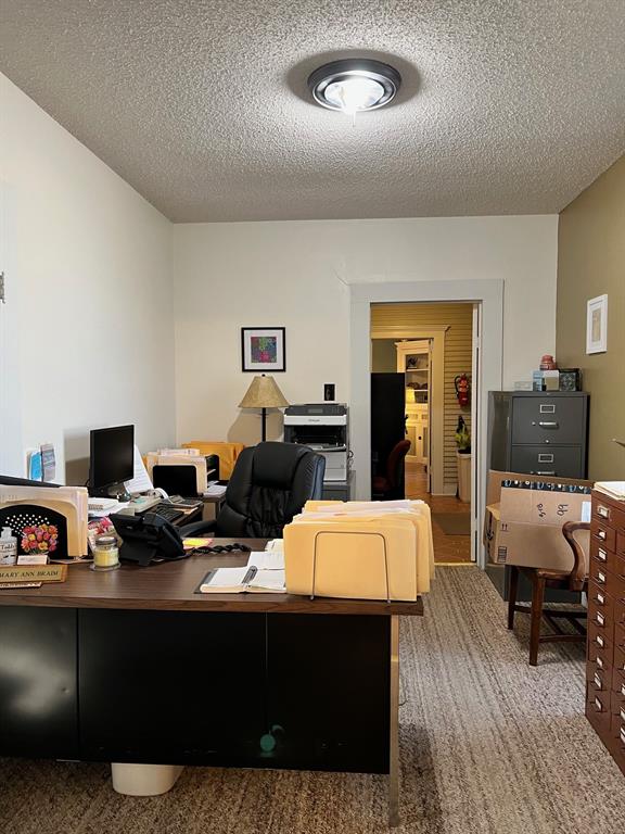 306 North Austin Street Comanche, TX 76442 - Photo 20 of 37 a living room with furniture and a wooden floor