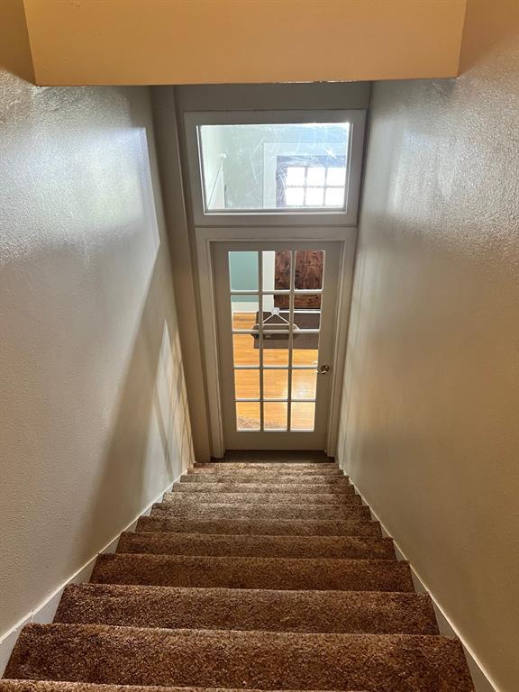 306 North Austin Street Comanche, TX 76442 - Photo 23 of 37 a view of a livingroom with a staircase