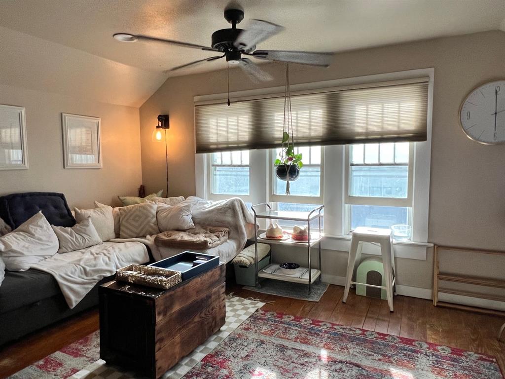 306 North Austin Street Comanche, TX 76442 - Photo 24 of 37 a living room with furniture a lamp and a window