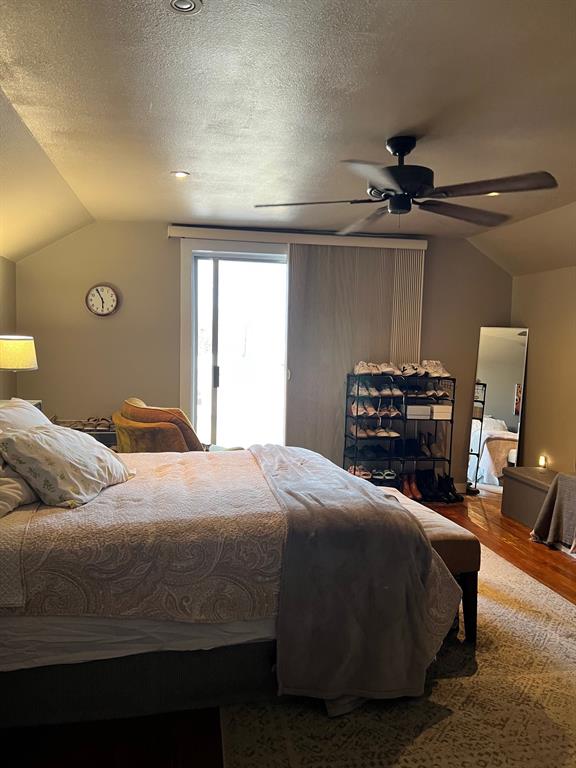 306 North Austin Street Comanche, TX 76442 - Photo 25 of 37 a bedroom with a bed and a chandelier