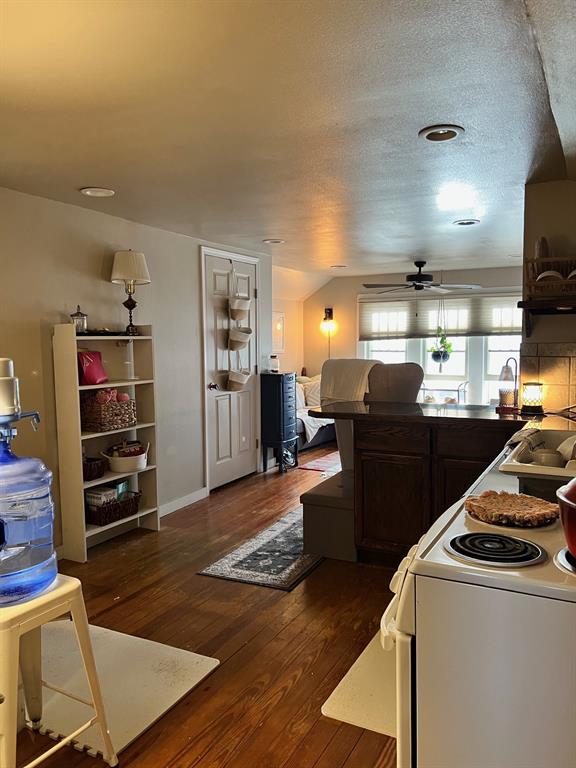 306 North Austin Street Comanche, TX 76442 - Photo 26 of 37 a kitchen with refrigerator and stove