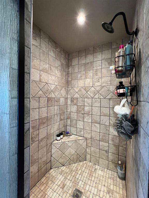 306 North Austin Street Comanche, TX 76442 - Photo 30 of 37 a bathroom with a sink a toilet and shower