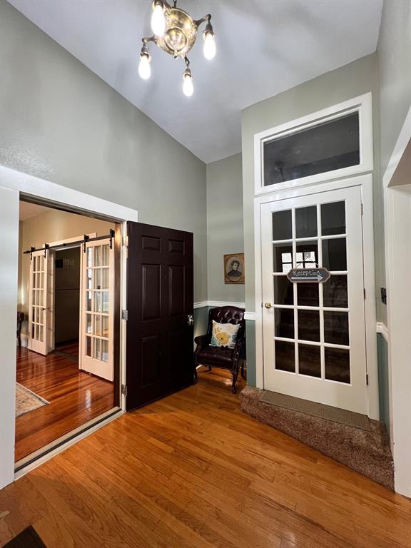 306 North Austin Street Comanche, TX 76442 - Photo 5 of 37 a view of empty room with windows
