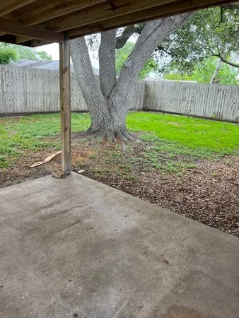 a view of backyard with green space